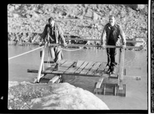 Unidentified men on a pontoon, Fox Glacier River