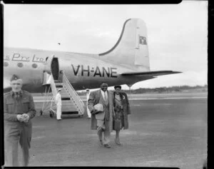 Mr and Mrs Claybourne, African-American wrestler arriving at Whenuapai, Auckland from Sydney, Australian National Airways (ANA) aircraft Arkana