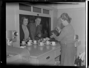 Mrs N Orchard, Mr F Hopkins and Mrs H D Christie pouring tea, location unidentified