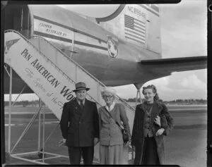 Ida Morsehead with Mr and Mrs Charlie Passmore, passengers on the airplane Clipper Westward Ho, Pan American World Airways