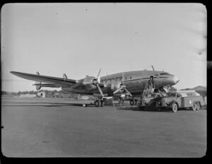 Lockheed Constellation aircraft being refuelled, Whenuapai