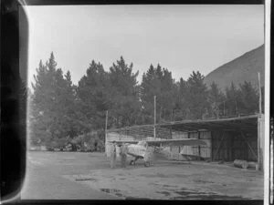 Two unidentified men and the Southern Scenic Airtrips Ltd's, Auster J/1 Autocrat, ZK-APO, aeroplane, [Queenstown?]