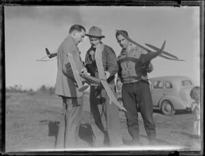 Unidentified group of men with model aircrafts, [Whenuapai?]