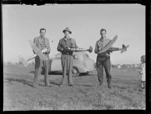 Unidentified group of men with model aircrafts, [Whenuapai?]