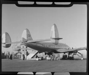 Qantas flight, BOAC (British Overseas Airways Corporation), Lockheed Constellation aircraft, arriving at Mascot Airport, New South Wales, Australia