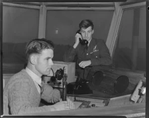 T W O Fox (seated) and Flight Lieutenant R G Burgess in the control tower, Royal New Zealand Air Force