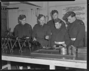 Cadet pilots A R Clarke, M W Jamieson, P E Dawson and A R Humphries, receiving instructions from Flight Sergeant C E Thomas how to use a Bren Gun
