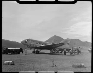 Mt Tavurvur (Matupit) in the background, with a Qantas Empire Airways, aeroplane in the foreground, Rabaul, New Britain, Papua New Guinea