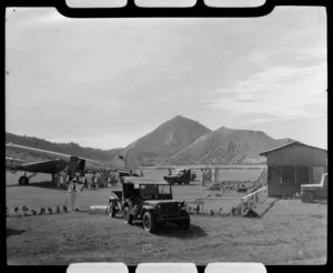 Mt Tavurvur (Matupit) in the background, with a Qantas Empire Airways aeroplane in the foreground, Rabaul, New Britain, Papua New Guinea