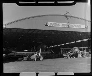 Engineers working on aircraft at Qantas Empire Airways workshop, Archerfield aerodrome, Brisbane, Australia