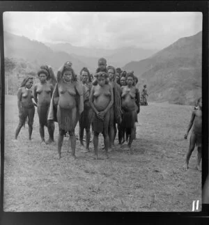 Group of local men and women, airstrip, Kerowagi, Simbu, Papua New Guinea