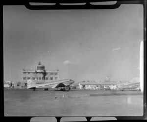 Control tower with Trans-Australia Airlines VH-AEU aircraft in front, Mascot airport, Sydney