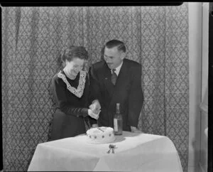 A couple cutting a cake at Trans Tasman Hotel [wedding anniversary ?]
