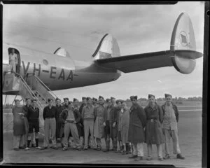 Air traffic control staff from Whenuapai Royal New Zealand Air Force base in front of Qantas Constellation Ross Smith