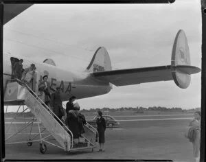 Passengers disembark from Qantas Constellation Ross Smith at Whenuapai Royal New Zealand Air Force base
