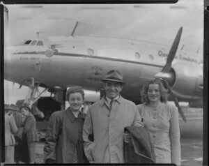 Passengers Mr Esdaile and daughters having disembarked from Qantas Constellation Ross Smith at Whenuapai Royal New Zealand Air Force base