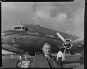 An unidentified passenger having arrived on Douglas DC-4 NC88951 Clipper Racer aircraft [Whenuapai Royal New Zealand Air Force base?]