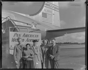 Mrs Smith, Professor Lite's mother-in-law, and an unidentified group, having arrived on Pan American World Airways Douglas DC-4 NC88951 Clipper Racer aircraft [Whenuapai Royal New Zealand Air Force base?]
