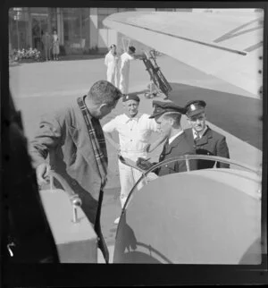 Qantas Empire Airways, checking passenger for boarding aircraft, Archerfield Airport, Brisbane, Australia