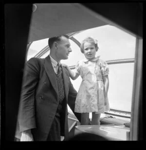 Passenger F N Gray and his young child Jennifer on Qantas Catalina flying boat service from Suva, Fiji, to Sydney, New South Wales, Australia