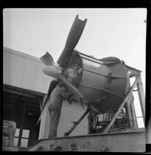 An unidentified engineer conducts a mobile engine test [at the Qantas workshop?], Sydney, New South Wales, Australia