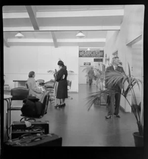 Unidentified passengers at the overseas terminal building, Sydney Airport, Mascot, New South Wales, Australia