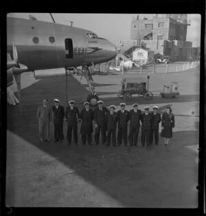 British Overseas Airways Corporation employees in front of refuelling Consellation [Beaufort, Speedbird] aircraft (loaned by Qantas), on arrival at Sydney Airport, Mascot, New South Wales, Australia