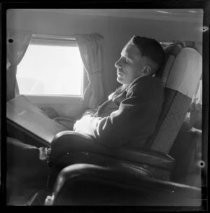 An unidentified male passenger sleeps on a National Airways Corporation Douglas DC-3 flight from Auckland to Suva