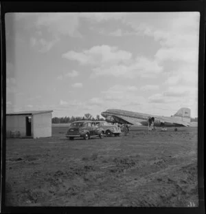 Unidentified passengers boarding on Trans Australia Airlines DC3 aeroplane at Griffith airport, Australia