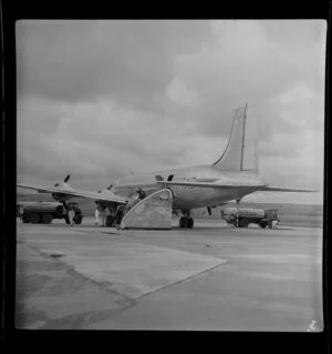 Part one of a two part panorama showing Trans Australian Airlines DC4 at Parafield airport, Adelaide, Australia