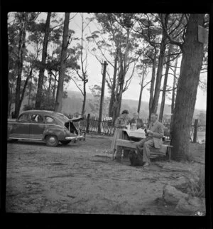 Members of the Stafford family having tea outdoor at Bulli Pass, New South Wales, Australia