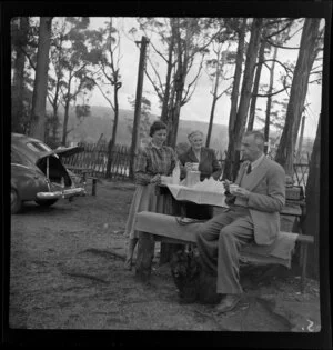 Members of the Stafford family having tea outdoor at Bulli Pass, New South Wales, Australia