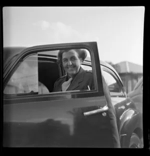 Unidentified women next to a car