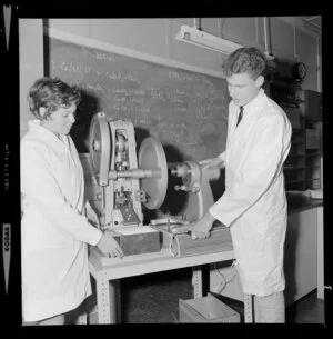 Pharmacy students using tablet making machine at the Central Institute of Technology, Petone, Wellington