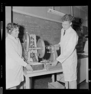 Pharmacy students using tablet making machine at the Central Institute of Technology, Petone, Wellington