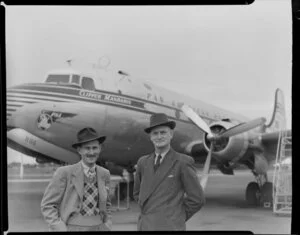Mr Farrell and M Govan in front of Pan American World Airways Clipper Mandarin aeroplane