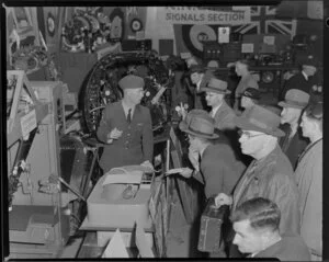 People viewing R.N.Z.A.F. display at the Battle of Britain Week exhibition, Town Hall, unknown location