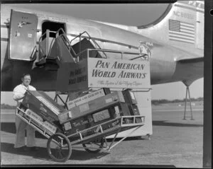 Luggage handler Ossie next to Pan American World Airways Clipper NC88951