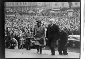 Rt Hon Peter Fraser and Viscount Bernard Law Montgomery, walking up Parliament steps, with crowd in the background, Wellington