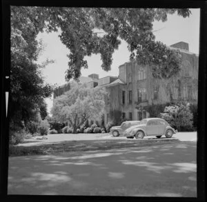 View of grounds with Volkswagen beetle, Massey University, Palmerston North