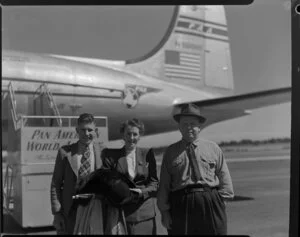 Pan American World Airways, passengers, Mr and Mrs Bevin with their son, [Whenuapai, Auckland?]