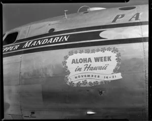 Pan American World Airways aircraft, Clipper Mandarin with Aloha Week in Hawaii, November 14 - 21 signage