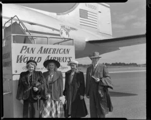 Group photograph on arrival of Pan American Airways airplane; Mrs Collyers, unidentified woman, Helen and Emmie Suttonfield
