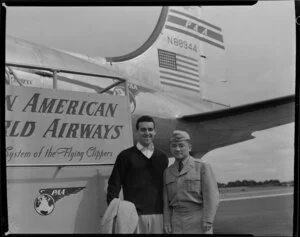 John McCormick and Dr Sammy Lee (diving champion), Pan American World Airways arrival N88944