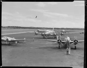 Line up of National Airways Corporation aircraft, Pan American World Airways aircraft and British Overseas Airways Corporation aircraft at Whenuapai airport, Waitakere