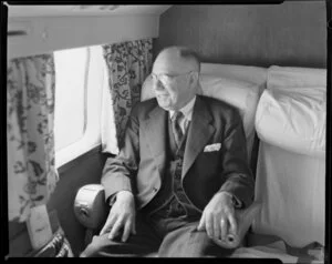 Auckland Mayor Mr John Andrew Charles Allum, seated in the DC6 aeroplane RMA Discovery