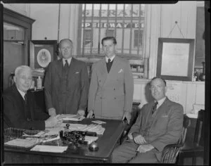 Kempthorne Prosser and Company employees Mr Foote and Mr Phillips and two unidentified men in the office