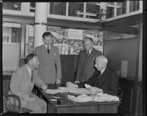 Kempthorne Prosser and Company employees Mr Foote and Mr Phillips and two other unidentified men in the office