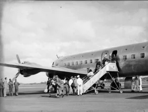 Passengers leaving the Douglas DC6 aeroplane