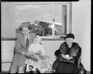 Miss Penner, Christchurch airport hostess with passengers